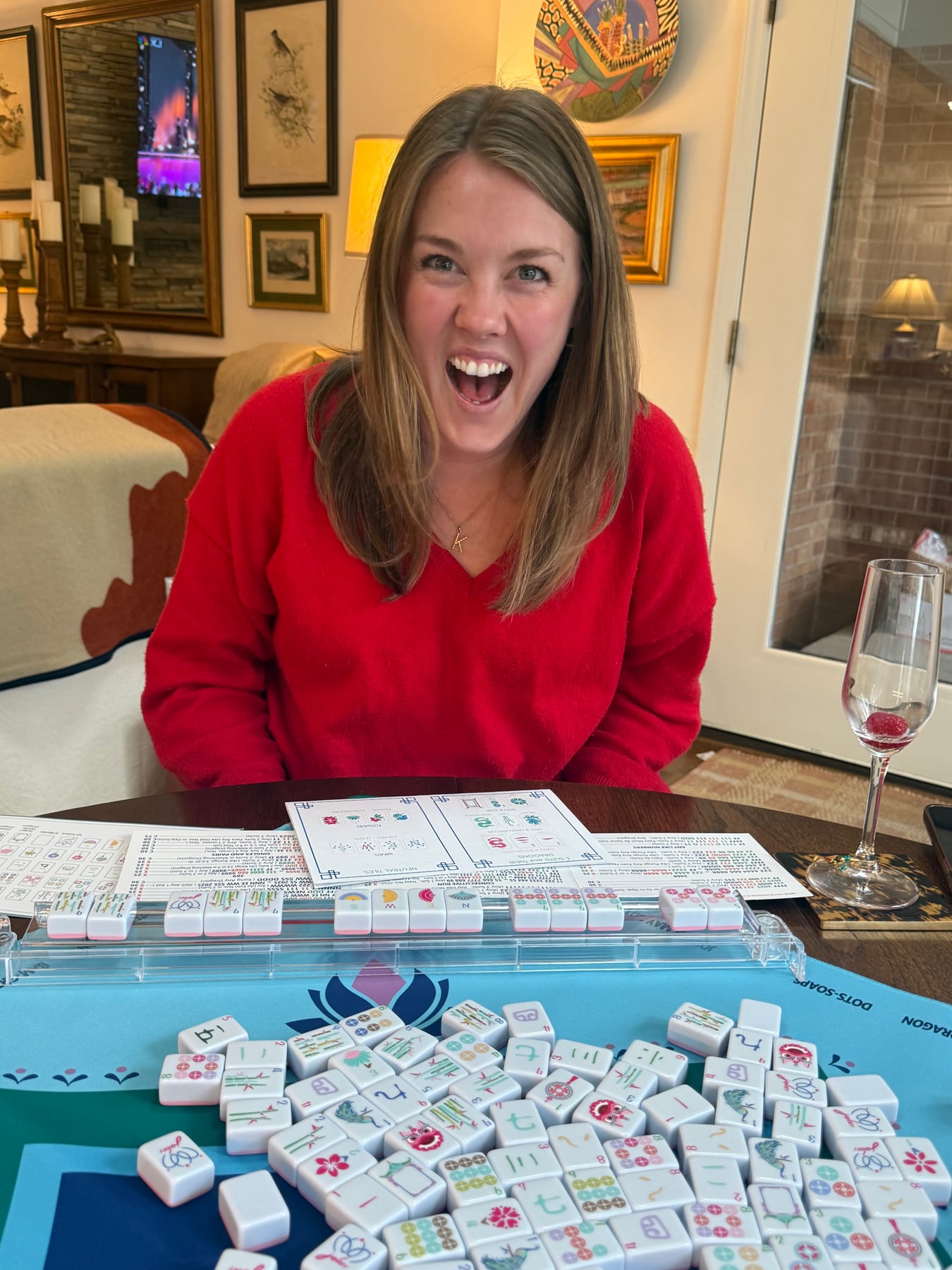 An excited new Mahjong player with her tiles