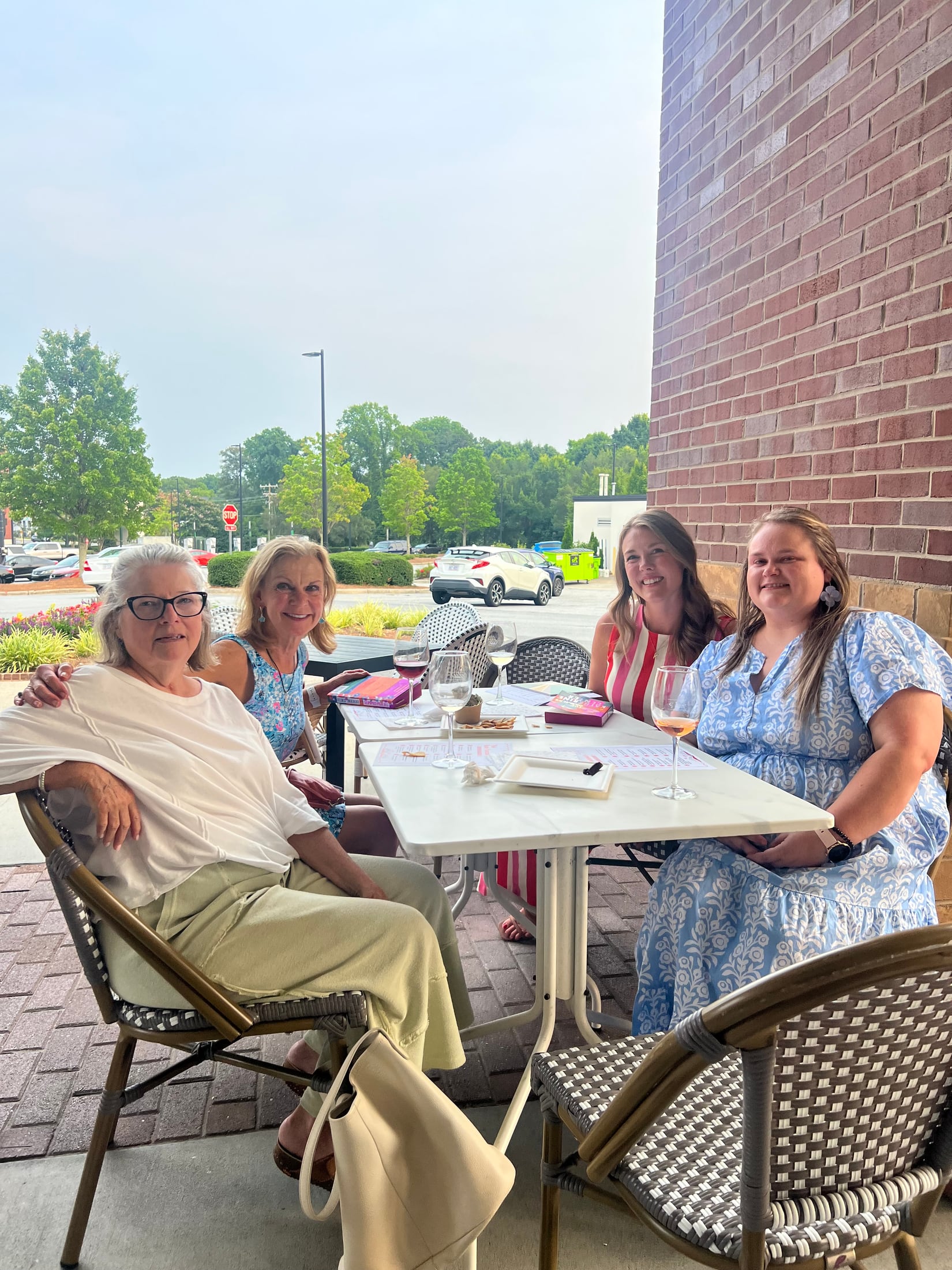 Pink Porch book club friends gathered on a patio