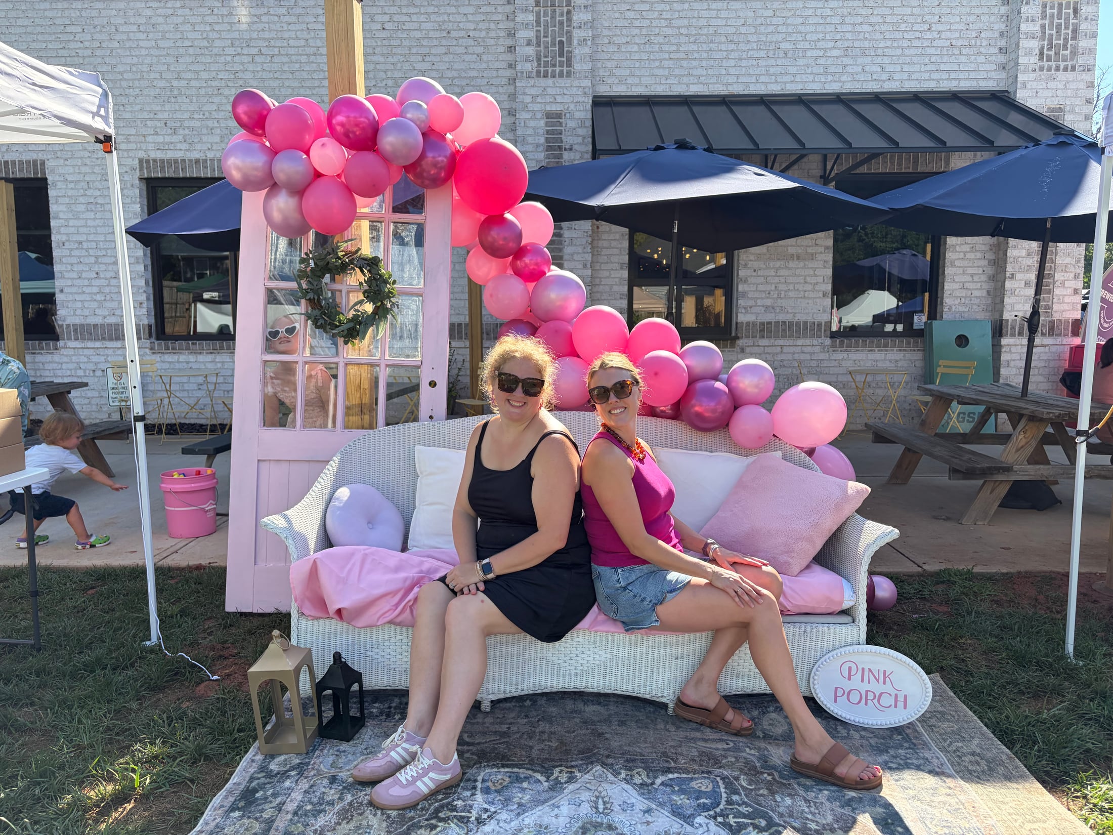 Sara and Katie at a Pink Porch market
